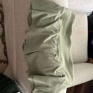 Caliia kick up performance short 3 inch inseam in a sage  green color